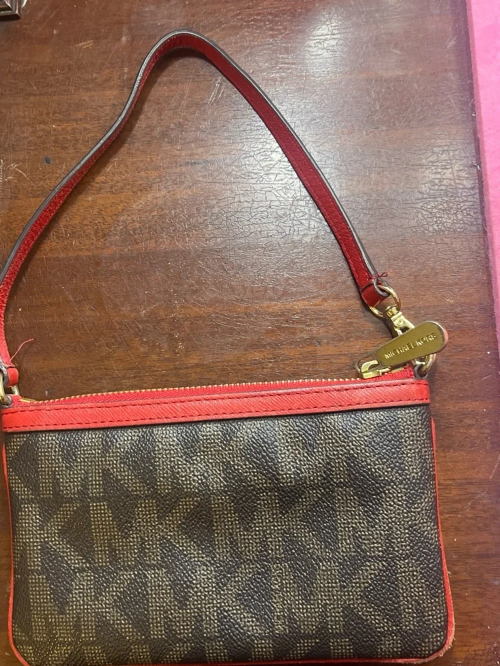 Michael Kors Brown Monogram Wristlet with Red Trim
